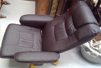 Lot 10 - A faux Leather Swivel Recliner and Stool.