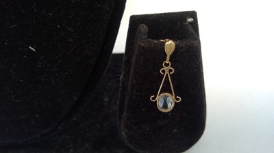 Lot 13 - A pair of 9ct gold drop earrings set with...