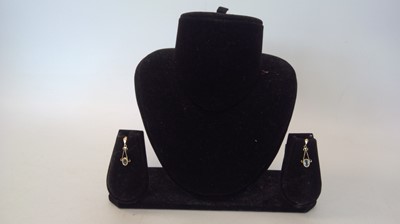 Lot 13 - A pair of 9ct gold drop earrings set with...