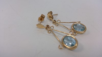 Lot 13 - A pair of 9ct gold drop earrings set with...