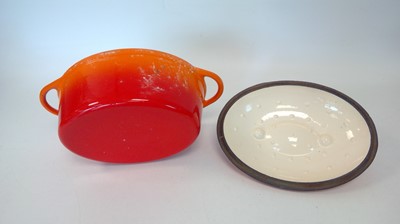 Lot 36 - An orange cast iron lidded dish, 32cm x 22cm x...