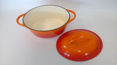 Lot 36 - An orange cast iron lidded dish, 32cm x 22cm x...