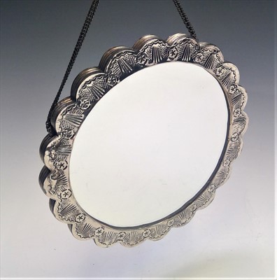 Lot 2008 - A Middle Eastern ornate lobed silver coloured...