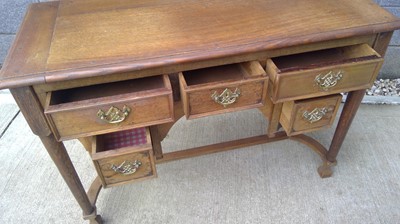 Lot 21 - An Oak, Knee Hole Writing Desk. The Desk...