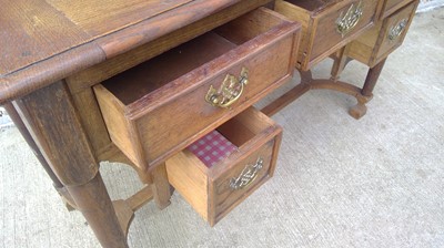 Lot 21 - An Oak, Knee Hole Writing Desk. The Desk...