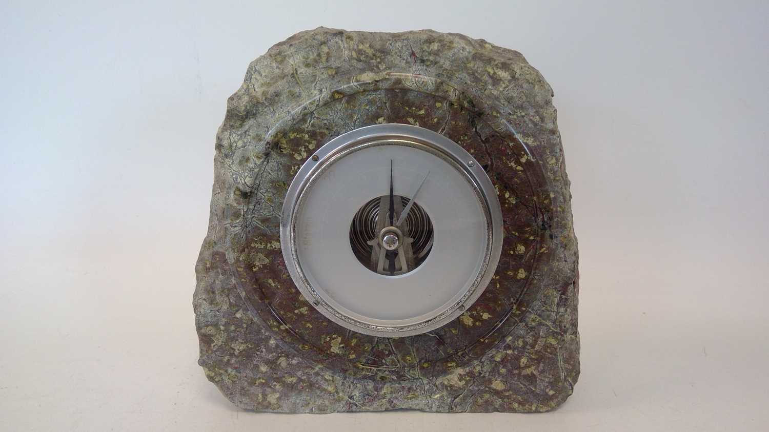 Lot 11 - A Serpentine barometer, height 20cm.