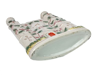 Lot 719 - A Victorian Staffordshire flatback castle spill holder.