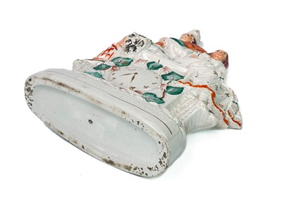 Lot 719 - A Victorian Staffordshire flatback castle spill holder.