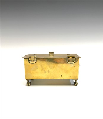 Lot 53 - A Georgian brass table snuff box on four ball...