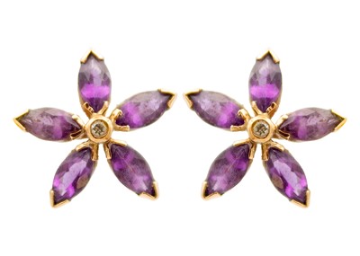 Lot 12 - A pair of Victorian 9ct rose gold amethyst and diamond set flower head earrings.