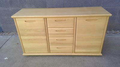 Lot 15 - A Blonde Oak Sideboard. The Sideboard measures...