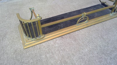 Lot 16 - A Brass Fender. The Fender measures 132cm wide...