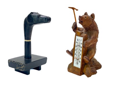 Lot 144 - A Black Forest carved bear desk barometer.