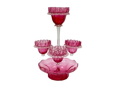 Lot 559 - A Victorian cranberry glass epergne.