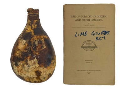 Lot 150 - A South American lime gourd.