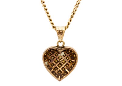 Lot 14 - A 9ct diamond set heart pendant on a 9ct curb link chain.