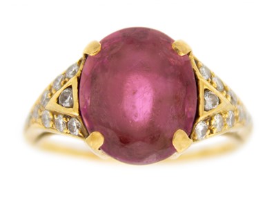 Lot 22 - An 18ct hallmarked gold pink Tourmaline and diamond set dress ring.