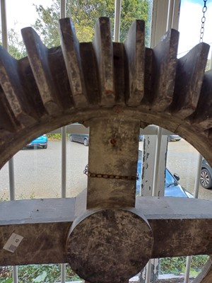 Lot 45 - A large gray painted hardwood cog pattern.