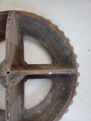 Lot 45 - A large gray painted hardwood cog pattern.