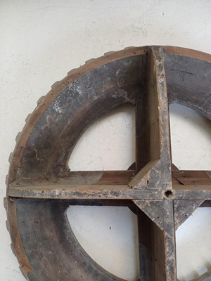 Lot 45 - A large gray painted hardwood cog pattern.