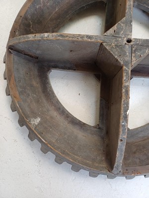 Lot 45 - A large gray painted hardwood cog pattern.