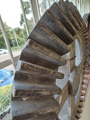 Lot 45 - A large gray painted hardwood cog pattern.