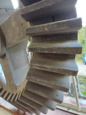 Lot 45 - A large gray painted hardwood cog pattern.