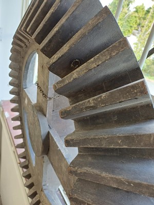 Lot 45 - A large gray painted hardwood cog pattern.