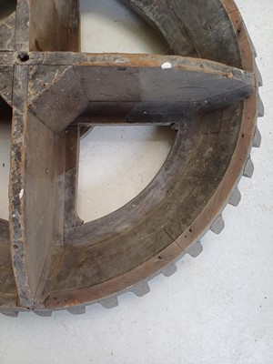 Lot 45 - A large gray painted hardwood cog pattern.