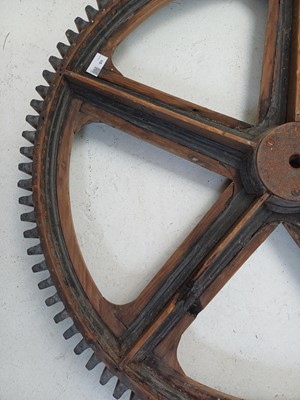 Lot 51 - A large painted wood and pine cog pattern.