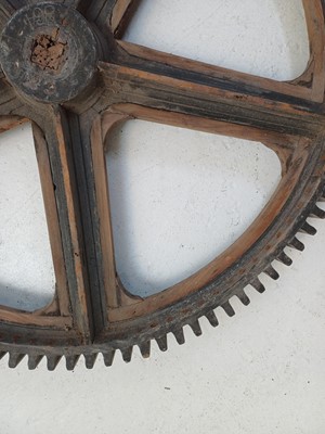 Lot 51 - A large painted wood and pine cog pattern.