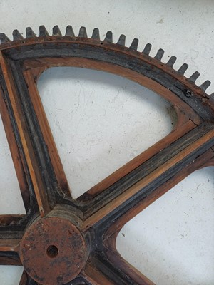 Lot 51 - A large painted wood and pine cog pattern.