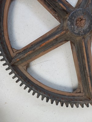 Lot 51 - A large painted wood and pine cog pattern.