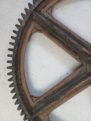 Lot 51 - A large painted wood and pine cog pattern.