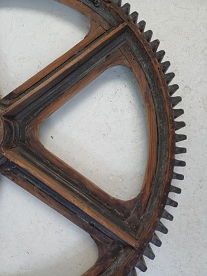 Lot 51 - A large painted wood and pine cog pattern.