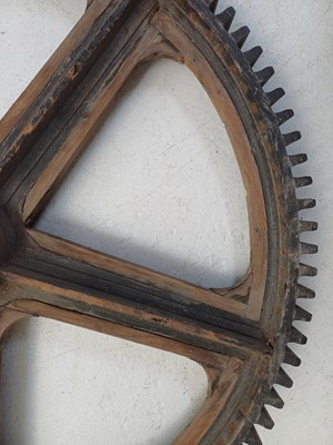 Lot 51 - A large painted wood and pine cog pattern.