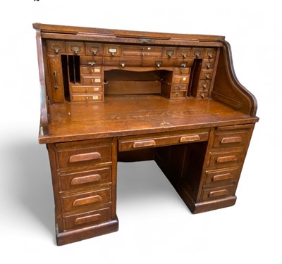 Lot 974 - An impressive roll-top desk.