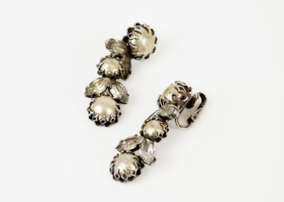 Lot 325 - MITCHEL MAER FOR CHRISTIAN DIOR - A pair of silver paste and faux pearl set clip earrings.