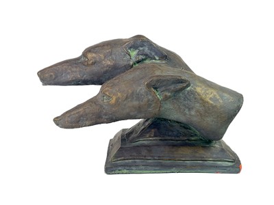 Lot 835 - A pair of reconstituted stone greyhound heads.