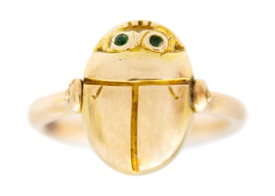 Lot 32 - A high purity gold (tests 14ct) Egyptian Revival scarab beetle swivel ring.