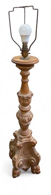 Lot 873 - A carved fruitwood table lamp