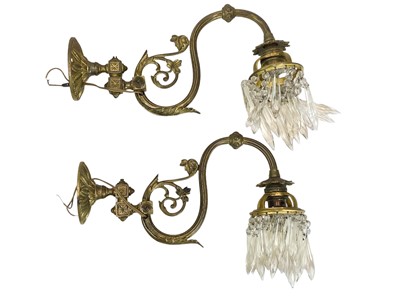 Lot 338 - A pair of cast brass wall lights.