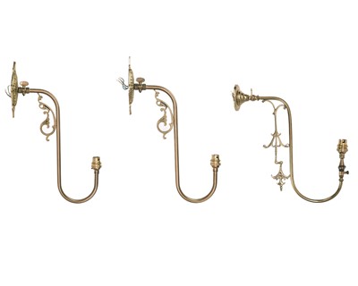 Lot 303 - A pair of brass swan neck wall lights.