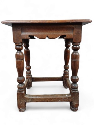 Lot 257 - An oak joint stool.