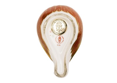 Lot 760 - Three Royal Doulton figures, a Royal Crown Derby paperweight, and a scent bottle.