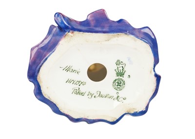 Lot 760 - Three Royal Doulton figures, a Royal Crown Derby paperweight, and a scent bottle.