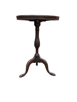 Lot 860 - An oak tripod wine table.