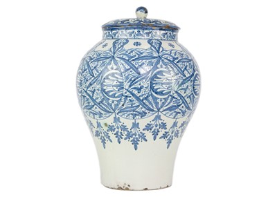 Lot 60 - A Moroccan blue and white pottery lidded khabia jar, 19th century.