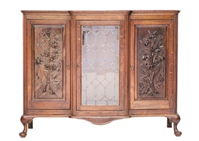 Lot 857 - Frank Rosier, an oak and linden wood display cabinet.