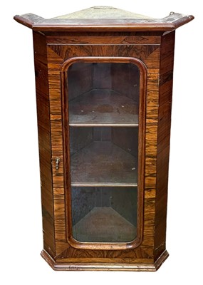 Lot 872 - A Victorian glazed rosewood hanging corner cupboard.